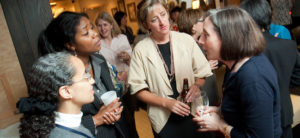 A group of women talk at the HLAW event