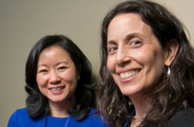 Two women smile at the camera during the HLAW event.
